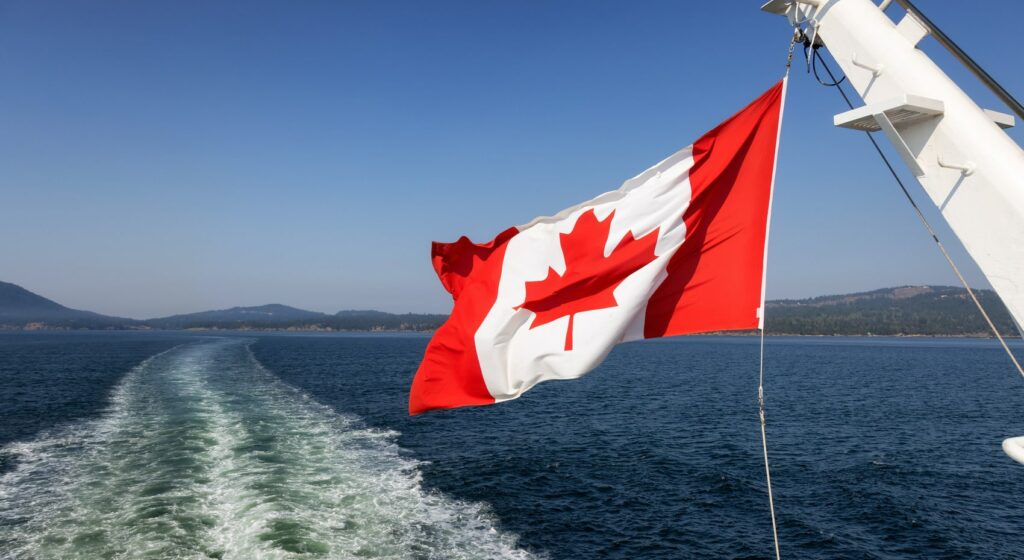 canadian-national-flag-on-a-back-of-a-ship-travel-min